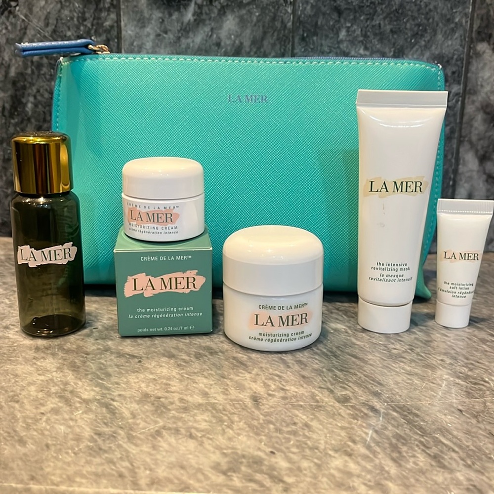 5 Empty La Mer Bottles/containers and a cosmetic bag (the bag is new).